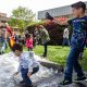 From left, Ryland Cordova, 2, and Aiden Cordova, 6, play in the snow during Snow Day at Quail Lakes Baptist Church in Stockton, Calif., on April 8, 2023. (Harika Maddala/Bay City News/Catchlight Local)