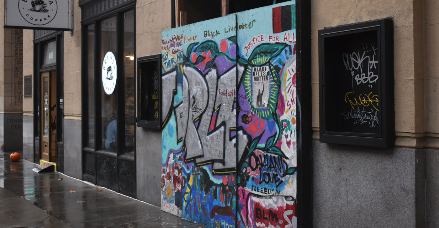 Improving downtown blight like the graffiti on this building façade in Oakland is one area business owners hoped would bring more foot traffic to the area. Photo by Magaly Muñoz.