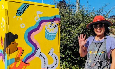 An artist stands by their work that transformed the utility box from drab to fab. Photo courtesy of the City of El Cerrito.
