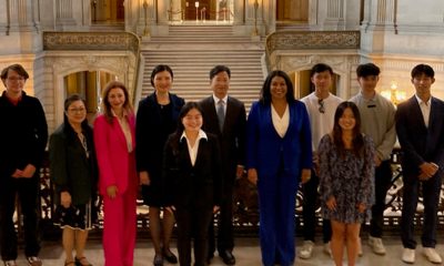 Mayor London Breed, fifth from right, is flanked on her right by Zhang Jianmin, consul general, consulate general of the People’s Republic of China, San Francisco; Madam Zheng Xin, wife of the consul general; Maryam Muduroglu, SF chief of protocol, and Darlene Chiu Bryant, Global SF executive director. They are joined by six of the eight college students from San Francisco following a send-off celebration for the students to participate in a summer exchange camp in Guangzhou, China. Photo by Conway Jones.