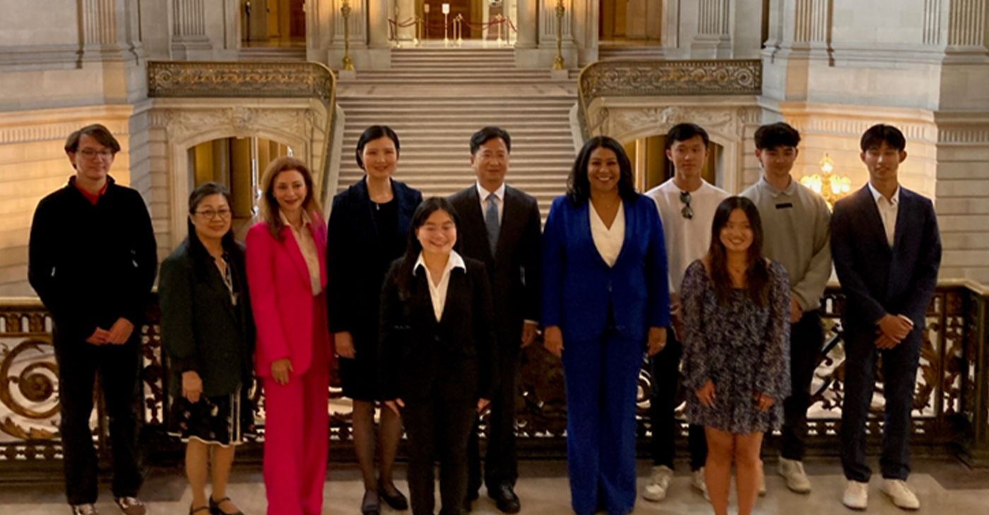 Mayor London Breed, fifth from right, is flanked on her right by Zhang Jianmin, consul general, consulate general of the People’s Republic of China, San Francisco; Madam Zheng Xin, wife of the consul general; Maryam Muduroglu, SF chief of protocol, and Darlene Chiu Bryant, Global SF executive director. They are joined by six of the eight college students from San Francisco following a send-off celebration for the students to participate in a summer exchange camp in Guangzhou, China. Photo by Conway Jones.