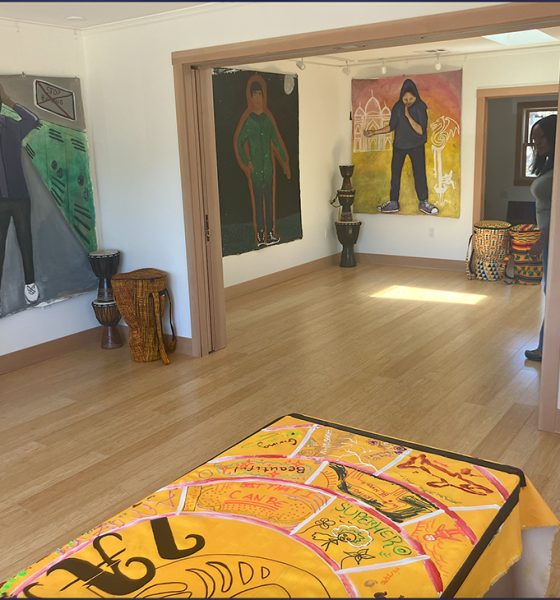 Artworks hang in The Center for ArtEsteem's new space at 3111 West St. in West Oakland on June 24. Photo by Zack Haber.