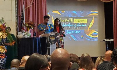 Councilmember Treva Reid presents honoree Children's Fairyland Executive Director Kymberly Miller with the Celebration of Freedom Award at the Juneteenth Rooted In the Town Celebration of Freedom Awards in downtown Oakland. Photo by Carla Thomas.