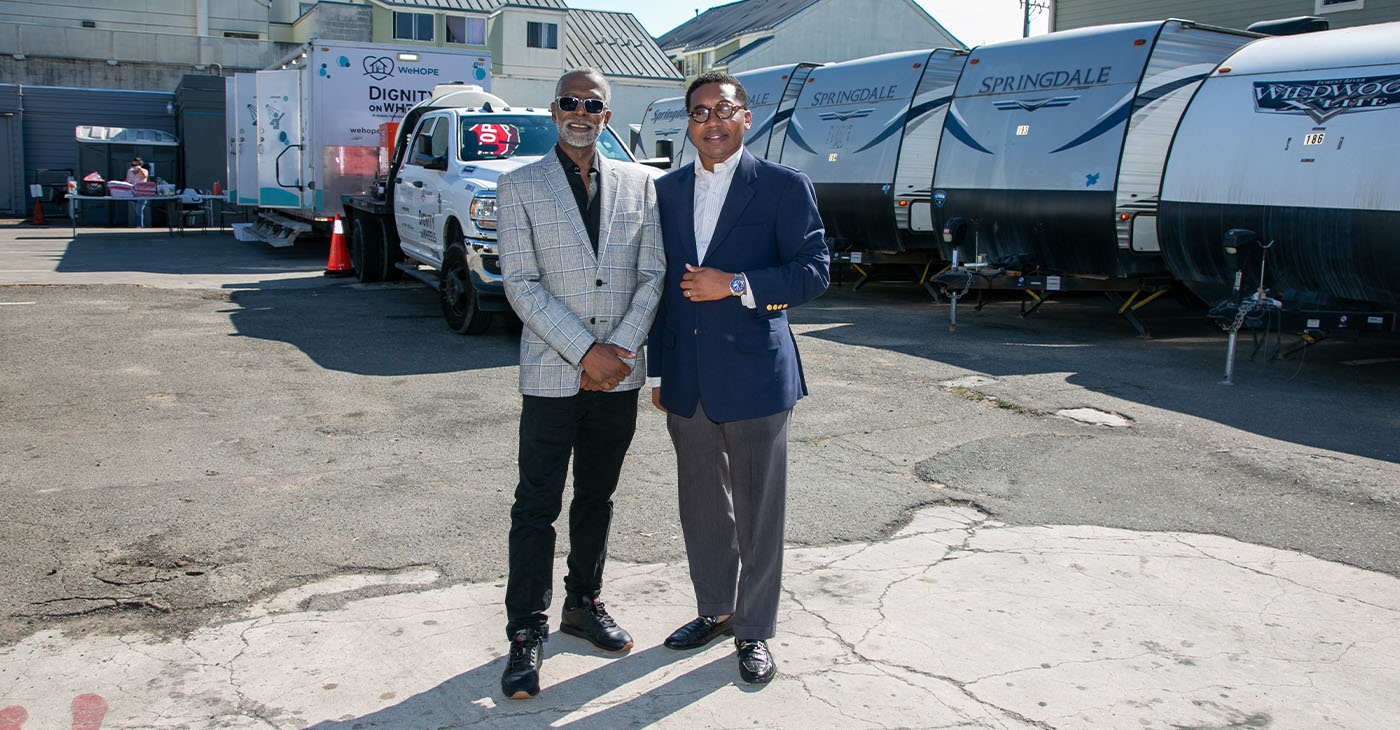 Founding ICAC President Pastor Ken Chambers, left, and Dr. Kenneth Anderson, first vice president of the state Baptist Convention and pastor of Williams Chapel Baptist Church, pose in front of the trailers that need renovation. Photo by Kevin Hicks, Hicks Media.