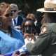 Carol Cherry, left, was presented with the Stars and Stripes flag by Kelli English, right, from the National Park Service to conclude the ceremony. Her father, Cyril Oscar Sheppard, Jr., was one of the 50 Black sailors convicted of mutiny after the explosions at Port Chicago killed 320 people in 1944. CBM photo by Antonio R. Harvey