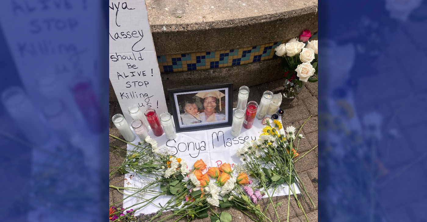 People place flowers and other items on the altar for Sonya Massey in front of the mural of police victim Breonna Taylor at 15thand Broadway at the Anti Police Terror Project’s response to a national call for action on July 28. Photo by Daisha Williams.