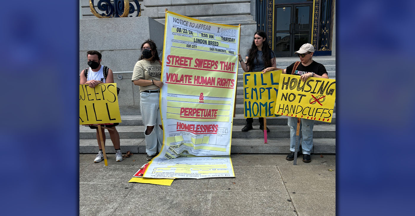 San Francisco homelessness advocates held a rally in front of City Hall to issue a symbolic citation to Mayor London Breed to stop sweeping encampments. Photo by Magaly Muñoz.