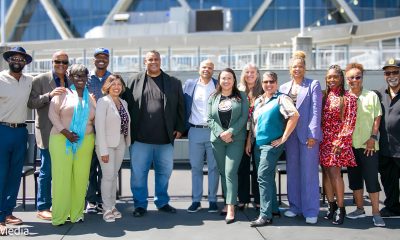 Mayor Sheng Thao, Councilmembers Nikki Bas and At-Large Councilmember Rebecca Kaplan celebrated the signing and the receipt of the first round of payments from some of the members of the African American Sports and Entertainment Group to purchase the Oakland/Alameda County Coliseum Complex. Left to right: Jonathan Jones, Alan Dones, C.J.Johnson, John Jones III, Nikki Bas, Ray Bobbitt, Ryan Richardson, Mayor Sheng Thao, Emily Weinreb, Rebecca Kaplan, Shonda Scott, Samantha Wise,Gay Plair Cobb and Paul Cobb. Photo by Kevin Hicks.