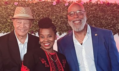 Two supporters, attorney Walter Riley (left) and Pastor Servant B.K. Woodson, stand with Councilmember Carroll Fife at her campaign kickoff, Saturday, Aug. 10 in West Oakland. Photo by Ken Epstein.