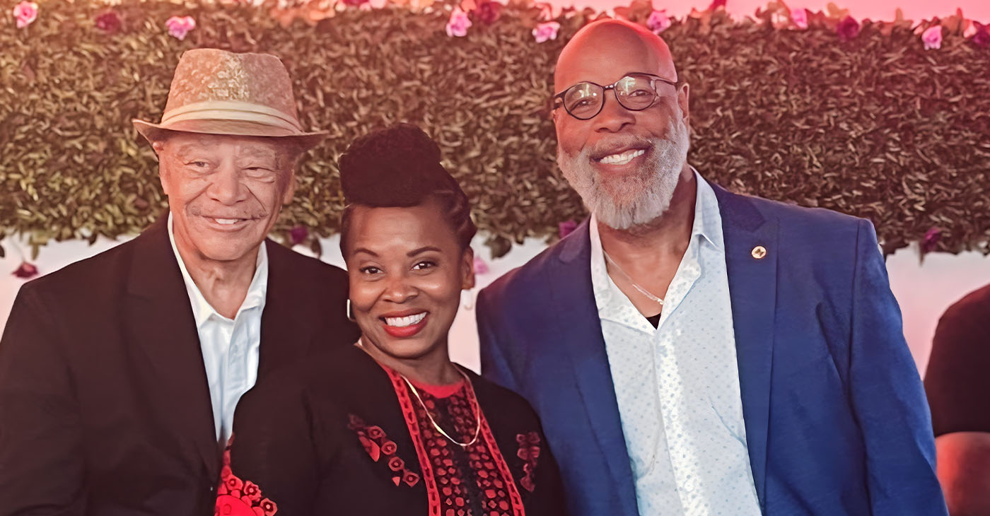 Two supporters, attorney Walter Riley (left) and Pastor Servant B.K. Woodson, stand with Councilmember Carroll Fife at her campaign kickoff, Saturday, Aug. 10 in West Oakland. Photo by Ken Epstein.