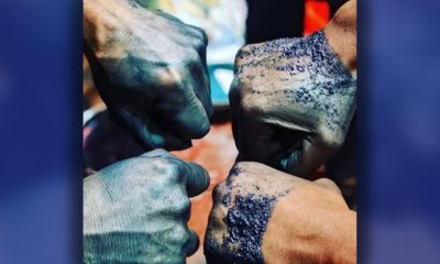 Workshop participants show how the dye looks on their skin. Prolonged exposure over years of dyeing will make the blue skin permanent. Photo courtesy Reshawn Goods