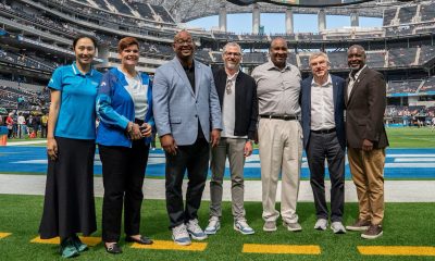 From left to right: IOC Member Hong Zhang, IOC Vice President Nicole Hoevertsz, Rex Richardson, Mayor of Long Beach, LA28 President Casey Wasserman, James T. Butts, Mayor of Inglewood, IOC President Thomas Bach, Marqueece Harris-Dawson, the President of the Los Angeles City Council (IOC/Greg Martin)