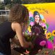 Jada Imani and another Black Tulip attendee building an altar at the Lake Merritt Amphitheater in honor of artist Zoe Reidy Watts, 25, who was killed in Oakland in March. Courtesy photo.