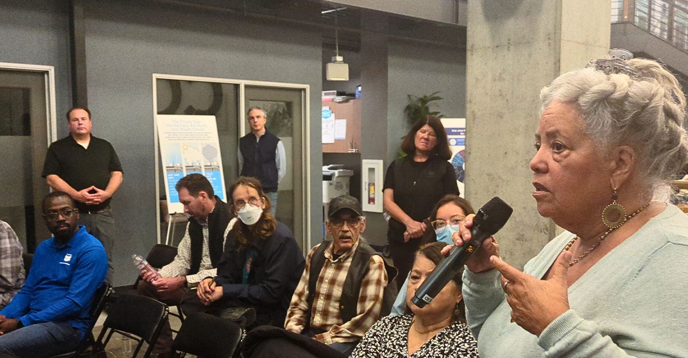 Community member Kathleen Sullivan speaks at the Chevron town hall. Photo courtesy Richmond Standard.