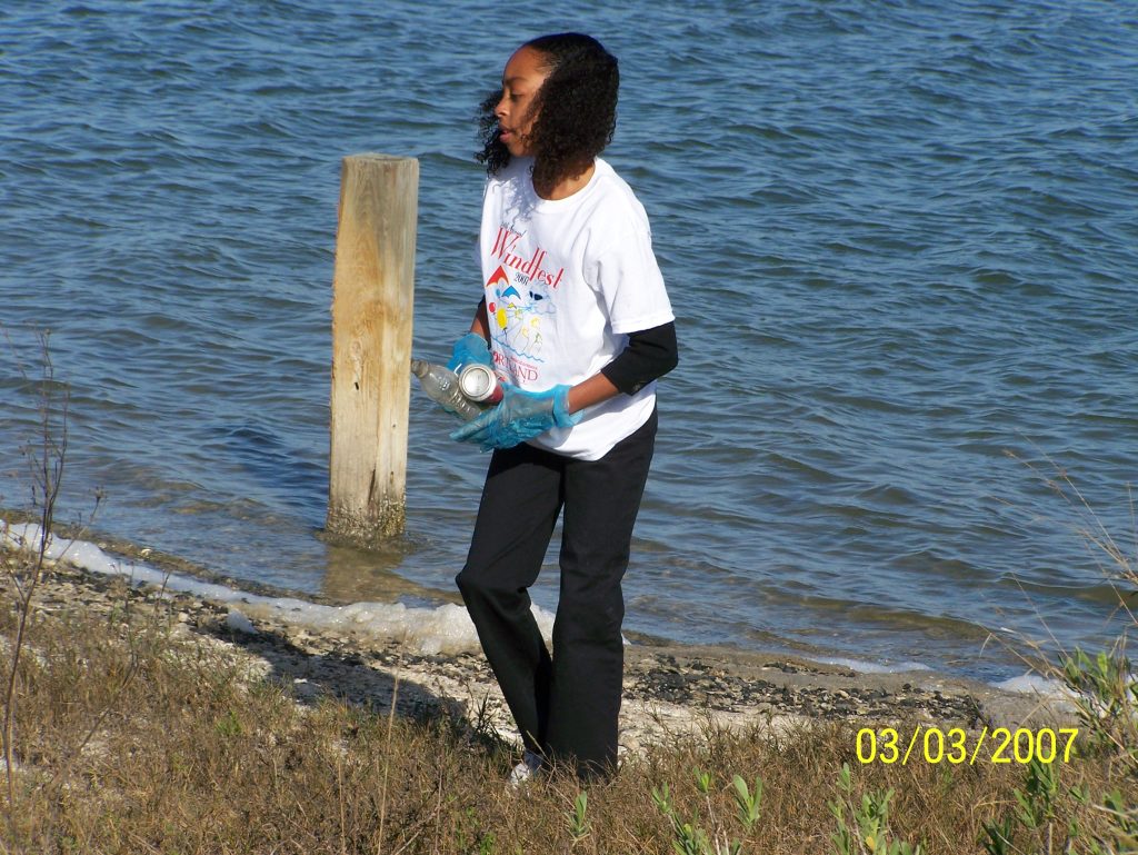 Young Keyanna volunteering at a beach clean up. Activism and giving back to her community has always been a key part of her upbringing. Courtesy photo.