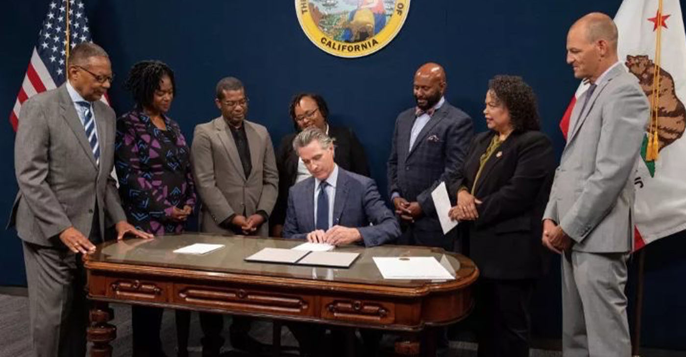 On Sept. 26, Gov. Gavin Newsom signed several bills in a priority reparations package introduced by the California Legislative Black Caucus (CLBC). In this photo (from left to right): Assemblymember Reggie Jones-Sawyer (D-Los Angeles); Sen. Lola Smallwood-Cuevas (D-Inglewood); Assemblymember Corey Jackson (D-Moreno Valley; CLBC Chair Assemblymember Lori Wilson (D-Suisun City); Assemblymember Mike Gipson (D-Carson); Assemblymember Mia Bonta (D-Oakland); and Assemblymember Kevin McCarty (D-Sacramento)