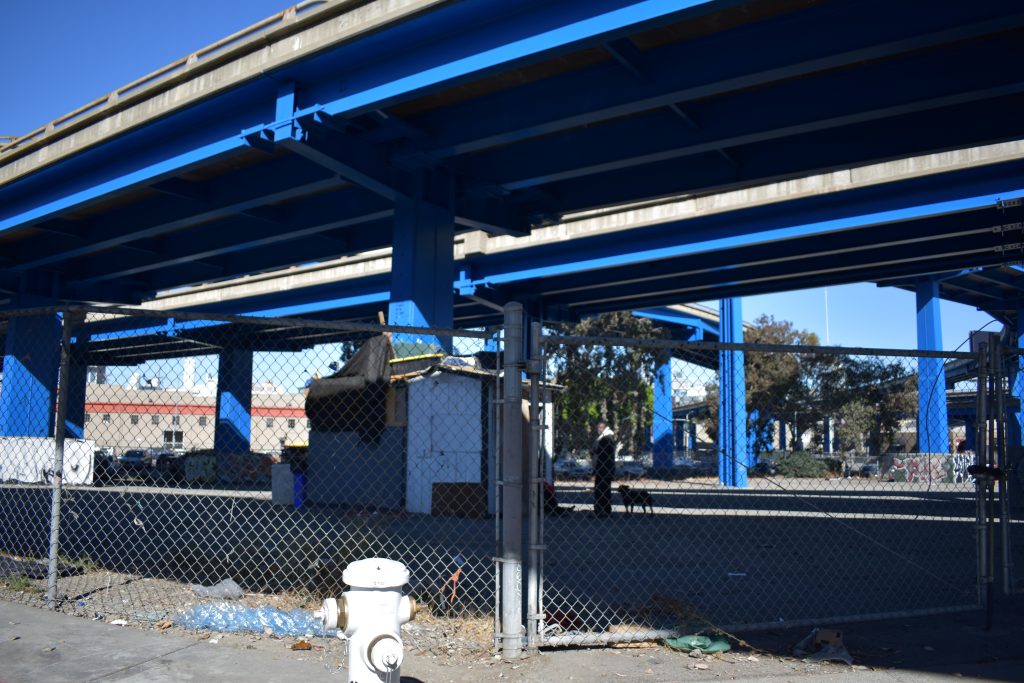 Makeshift structures built from plywood and tarps are starting to pop up more throughout the city. Certain areas under freeways are not under direct authority from San Francisco, making it harder to sweep these encampments. Photo by Magaly Muñoz.