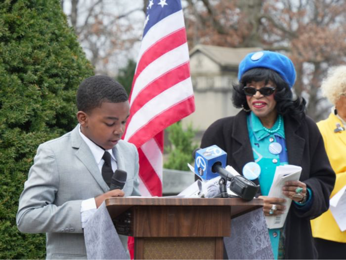 12-year-old King Hutchinson, a student at Burnside Scholastic Academy, delivers remarks at the wreath-laying ceremony (Photo Credit: Tacuma R. Roeback).