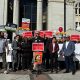 Supporters of the recalls against Oakland Mayor Sheng Thao and Alameda County District Attorney Pamela Price, along with local political candidates and business owners, at a press conference outside Oakland City Hall. Speakers called for a city-wide, one-day business strike to protest against threats to public safety. Photo by Magaly Muñoz.