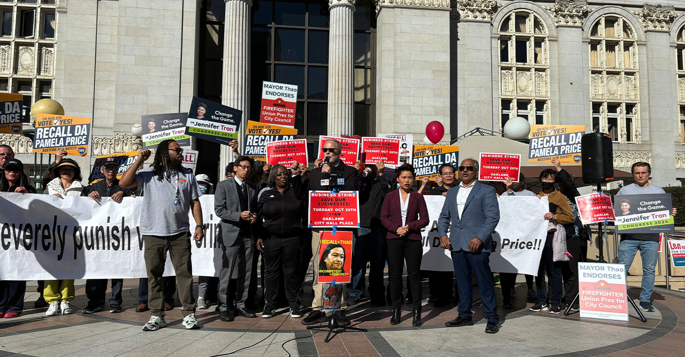 Supporters of the recalls against Oakland Mayor Sheng Thao and Alameda County District Attorney Pamela Price, along with local political candidates and business owners, at a press conference outside Oakland City Hall. Speakers called for a city-wide, one-day business strike to protest against threats to public safety. Photo by Magaly Muñoz.