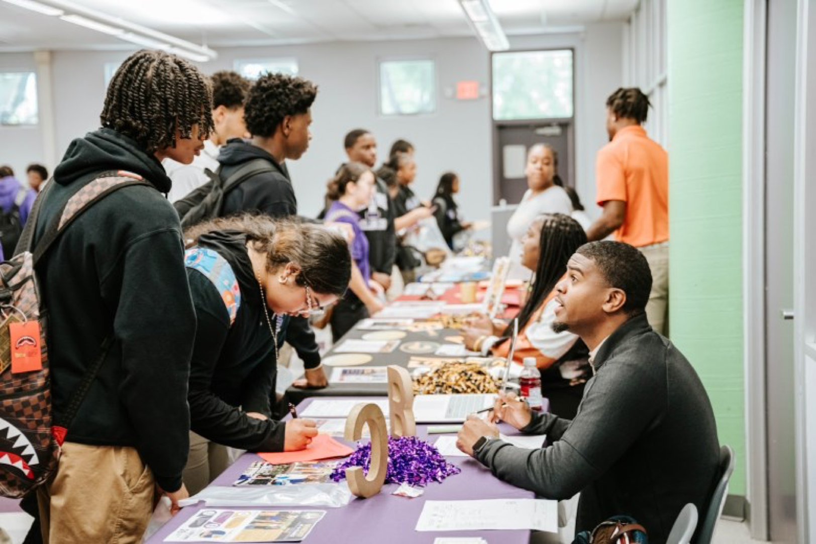 Benedict College recruiter Amir Roberts and Sac High students discuss the benefits of attending an HBCU. Erin Campbell, OBSERVER