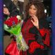 While holding a bouquet of flowers, District Attorney Pamela Price waves goodbye to supporters as she leaves her East Oakland office. Courtesy photo