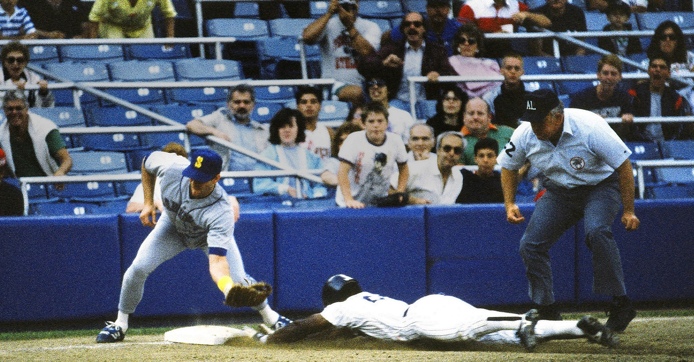 Baseball great Rickey Henderson in the act of stealing one of the 1,406 bases he stole in his 25-year career. Photo: Wikimedia Commons.