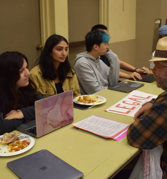 UC Berkeley Law Students help a clinic visitor with legal advice at their Tuesday night services. The Clinic offers a variety of resources, including medical, to those in the community who have little access to these services. Photo by Magaly Muñoz