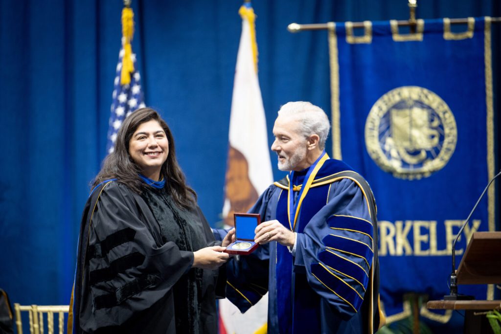 Khadija Bakhtiar, left, received the Elise and Walter A. Haas International Award from UC Berkley Chancellor Rich Lyons. Photo by Keegan Houser/UC Berkeley.