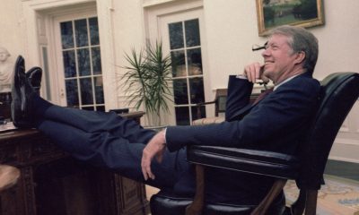 President Jimmy Carter sits casually with his feet on the table at the Resolute desk in the Oval Office of the White House on April 18, 1978. Photo by Valkoisen Tuntematon/Wikimedia Commons.