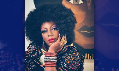 Carla Lawson poses by one of her large canvas works. Courtesy photo.