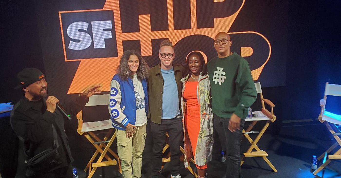 At the inaugural SF Hip Hop festival at The Midway in San Francisco panelists X.Eyee, CEO of Malo Santo and senior advisor for UC Berkeley’s AI Policy, Sean Kantrowitz, director of media and content @Will.I.A.’s FYI, Julie Wenah, chairwoman of the Digital Civil Rights Coalition, and Adisa Banjoko, of 64 Blocks and Bishop Chronicles podcast pose together. Photo by Carla Thomas.