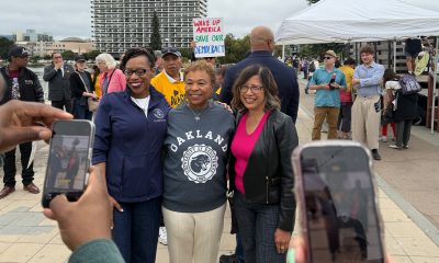 Speakers at the Aug 16 pro-democracy rally at Lake Merritt in Oakland included Congresswoman Lateefah Simon, Oakland Mayor Barbara Lee, and Alameda County Supervisor Nikki Fortunato Bas. Photo by Ken Epstein.